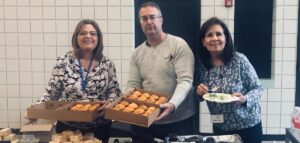 Monica, Gene and Sharon are serving food at The Well Conference.