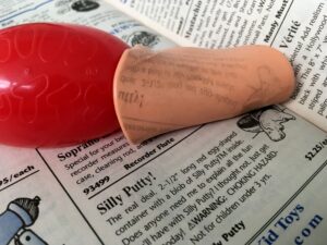 Silly Puddy on Newspaper